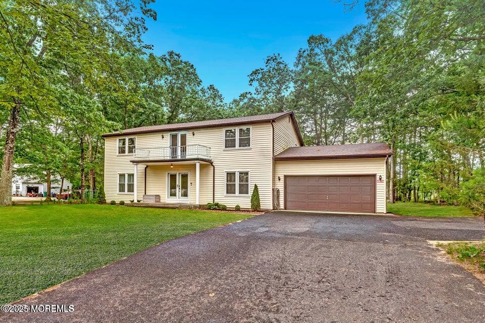 718 East Veterans Highway Jackson, NJ 08527 - Photo 1 of 32 a front view of a house with yard and green space