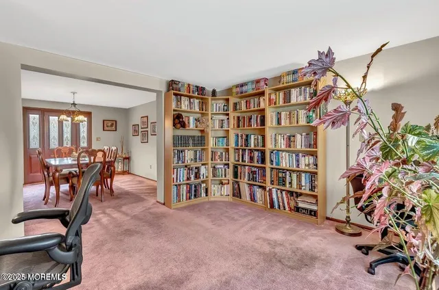 a view of a livingroom with furniture and a window