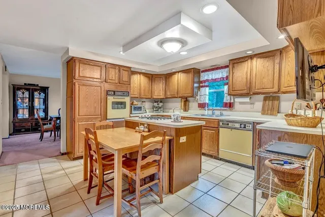 a kitchen with a sink cabinets and window