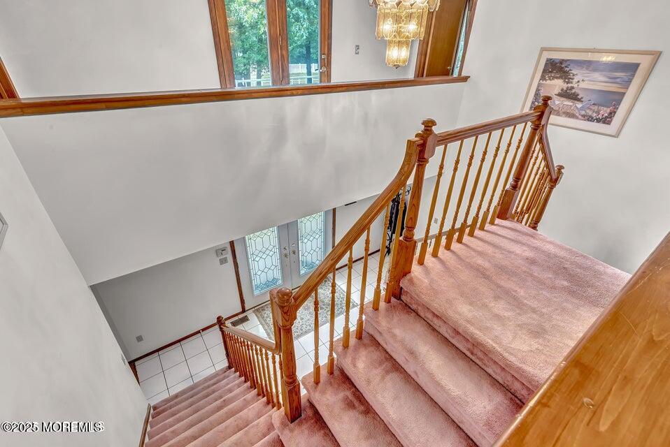 718 East Veterans Highway Jackson, NJ 08527 - Photo 19 of 32 a view of staircase with wooden floor and a window