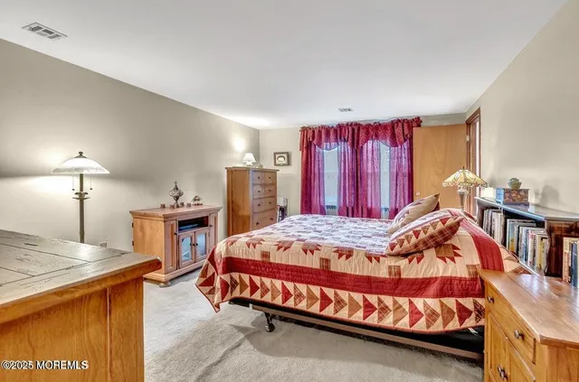 a bedroom with a bed and a closet