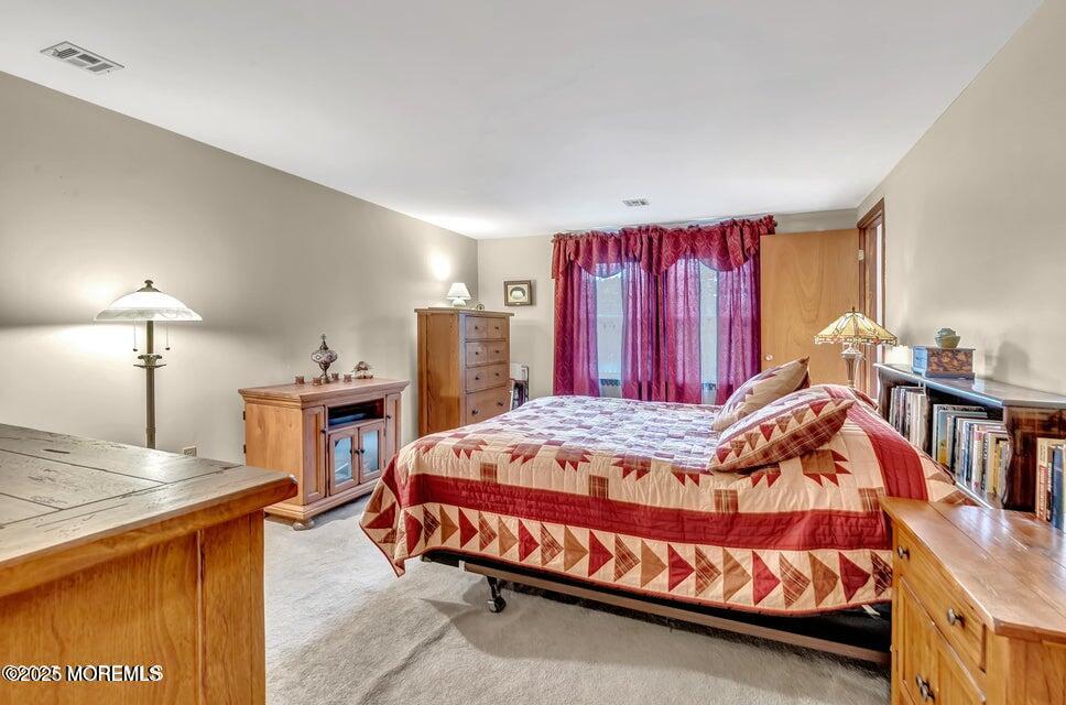 718 East Veterans Highway Jackson, NJ 08527 - Photo 22 of 32 a bedroom with a bed and a closet