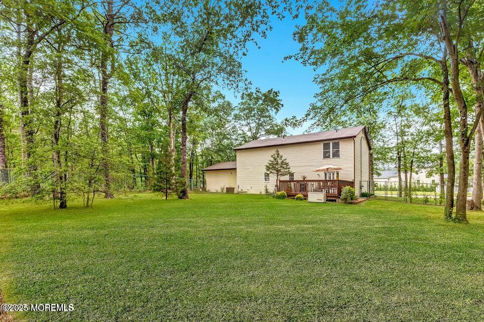 718 East Veterans Highway Jackson, NJ 08527 - Photo 31 of 32 a view of a house with a big yard and large trees