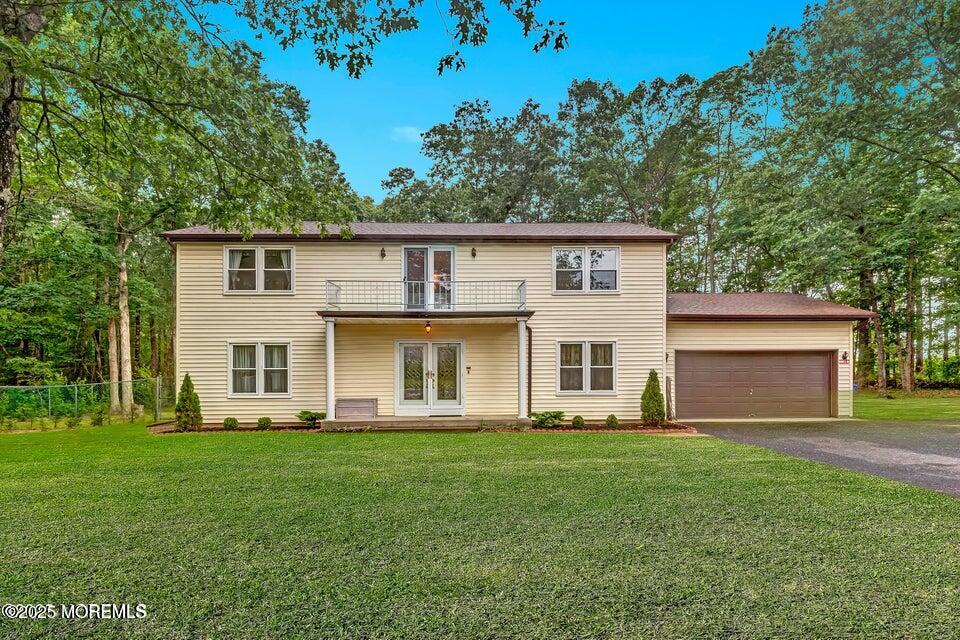 718 East Veterans Highway Jackson, NJ 08527 - Photo 5 of 32 a front view of a house with a yard