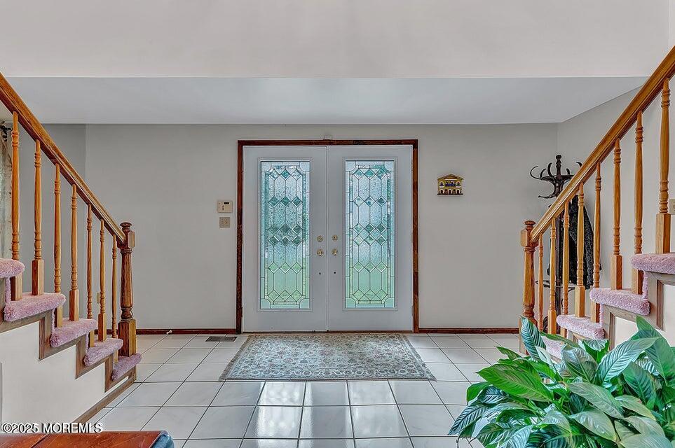 718 East Veterans Highway Jackson, NJ 08527 - Photo 7 of 32 a view of an entryway with staircase