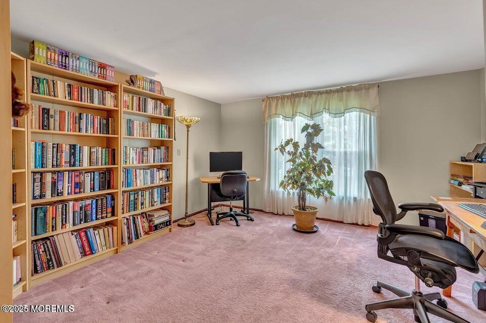 718 East Veterans Highway Jackson, NJ 08527 - Photo 10 of 32 a view of a workspace with furniture and a bookshelf