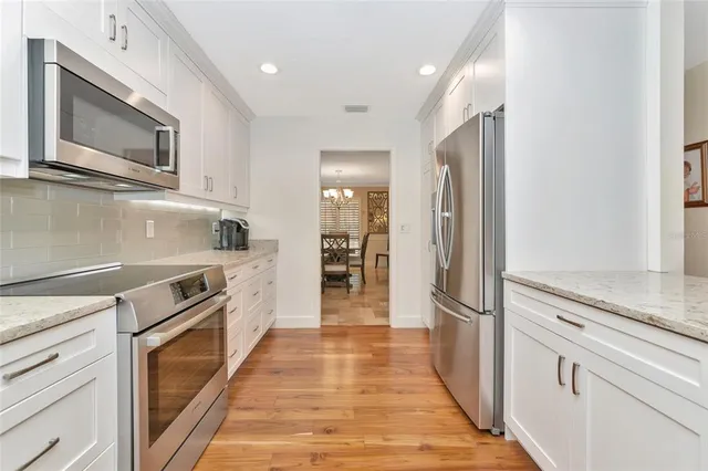 a spacious bathroom with a bathtub and a shower