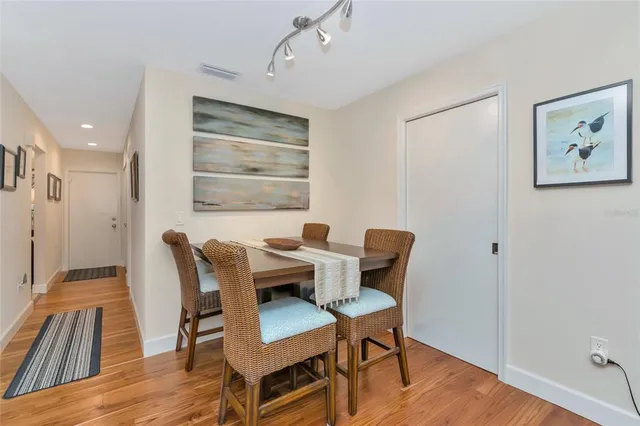 a bedroom with a bed and a dresser in it