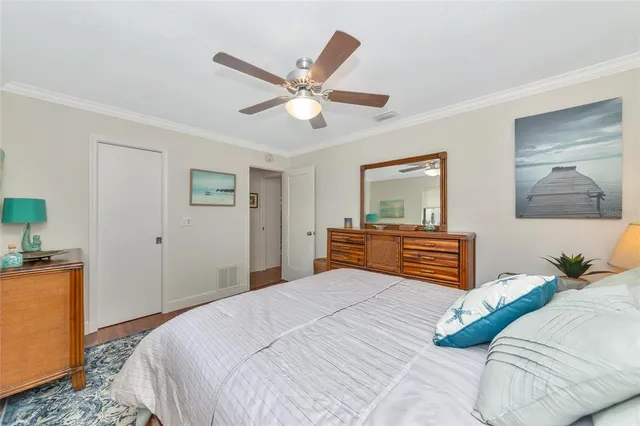 an aerial view of a house with outdoor space pool tennis courts and ocean view
