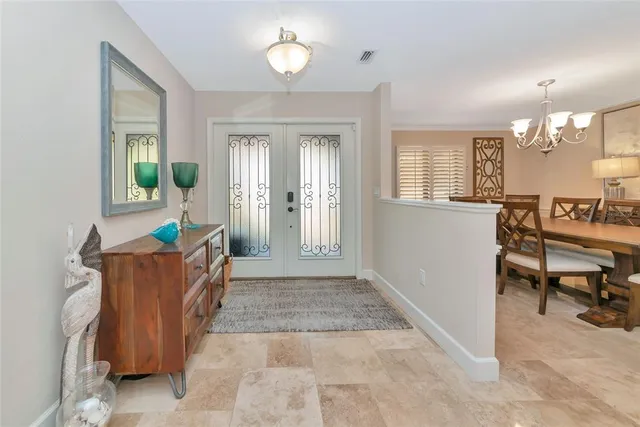 a living room with furniture a flat screen tv and a window