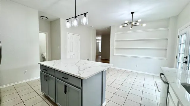 a room with a chandelier furniture and a chandelier