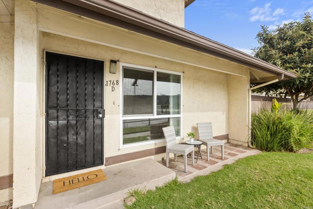 1768 Regency Way, Unit D Chula Vista, CA 91911 - Photo 2 of 32 a view of a patio with table and chairs and potted plants