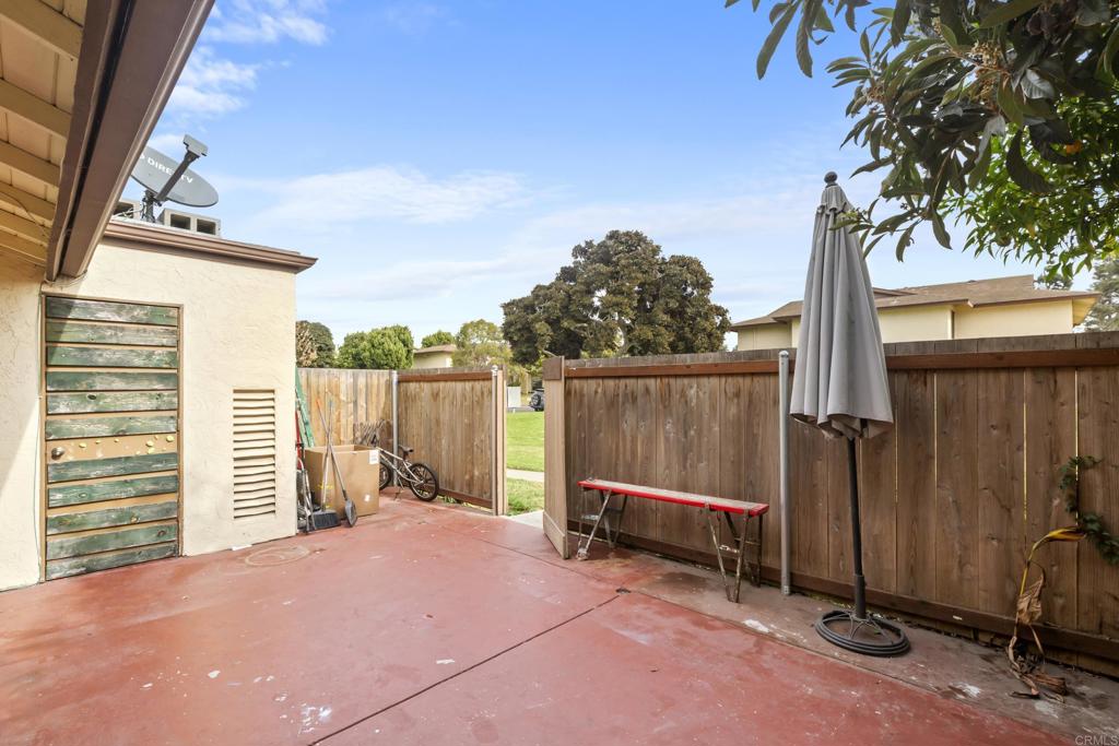 1768 Regency Way, Unit D Chula Vista, CA 91911 - Photo 21 of 32 a view of backyard with barbeque grill and wooden fence