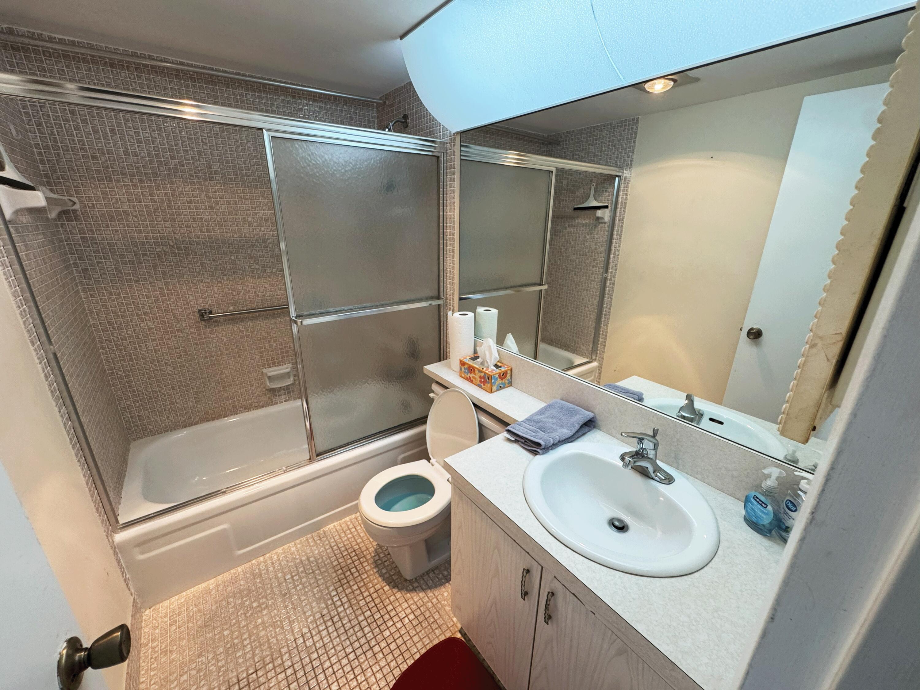 4075 Cornwall East Boca Raton, FL 33434 - Photo 7 of 30 a bathroom with a sink toilet and shower