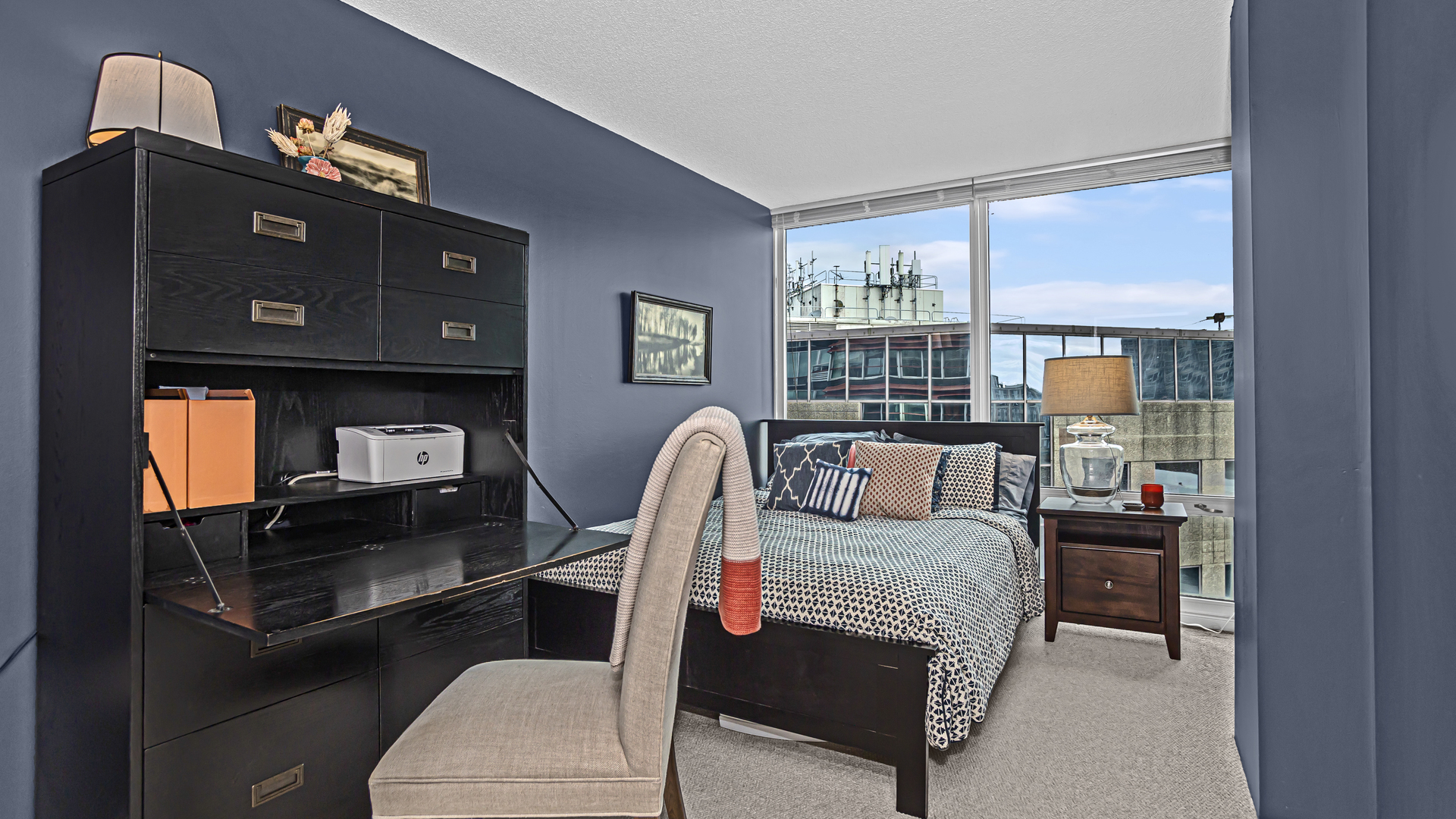 800 Elgin Road, Unit 1221 Evanston, IL 60201 - Photo 12 of 23 a living room with furniture and a fireplace