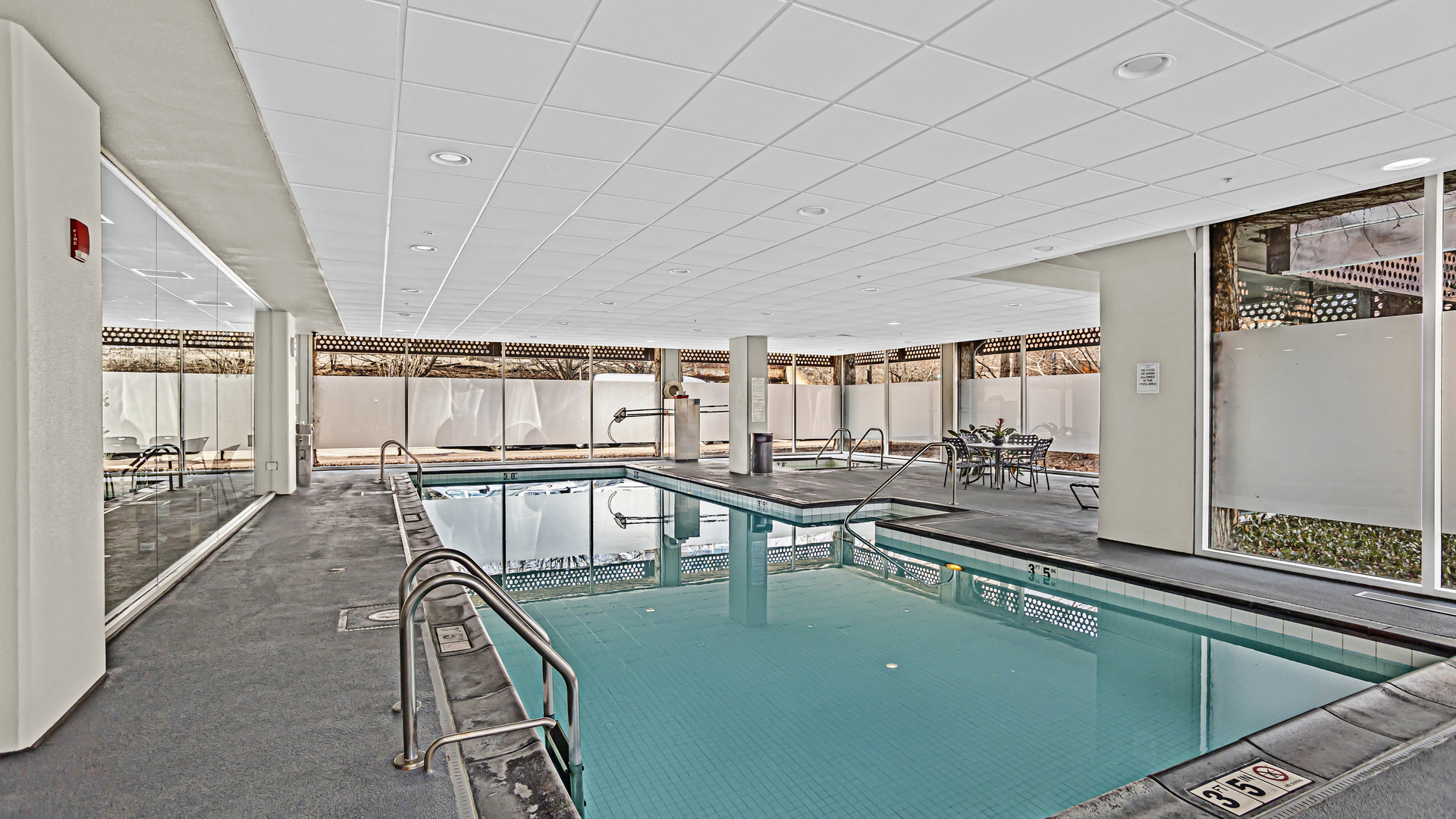 800 Elgin Road, Unit 1221 Evanston, IL 60201 - Photo 18 of 23 a living room with lots of furniture and a chandelier