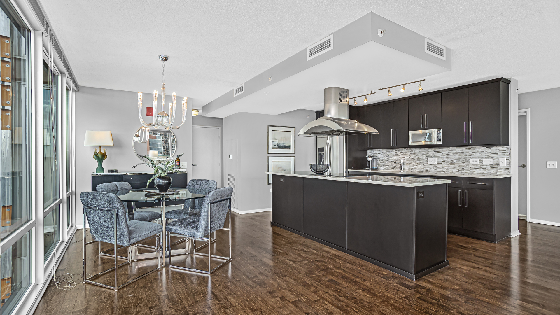800 Elgin Road, Unit 1221 Evanston, IL 60201 - Photo 4 of 23 a kitchen with stainless steel appliances kitchen island granite countertop a sink and cabinets