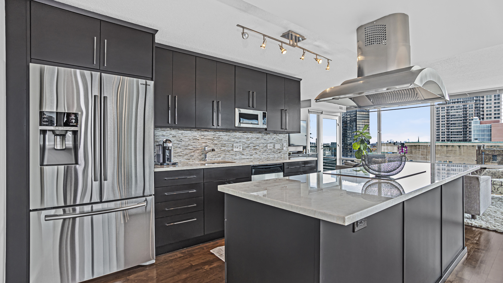 800 Elgin Road, Unit 1221 Evanston, IL 60201 - Photo 5 of 23 a kitchen with kitchen island a sink appliances and cabinets