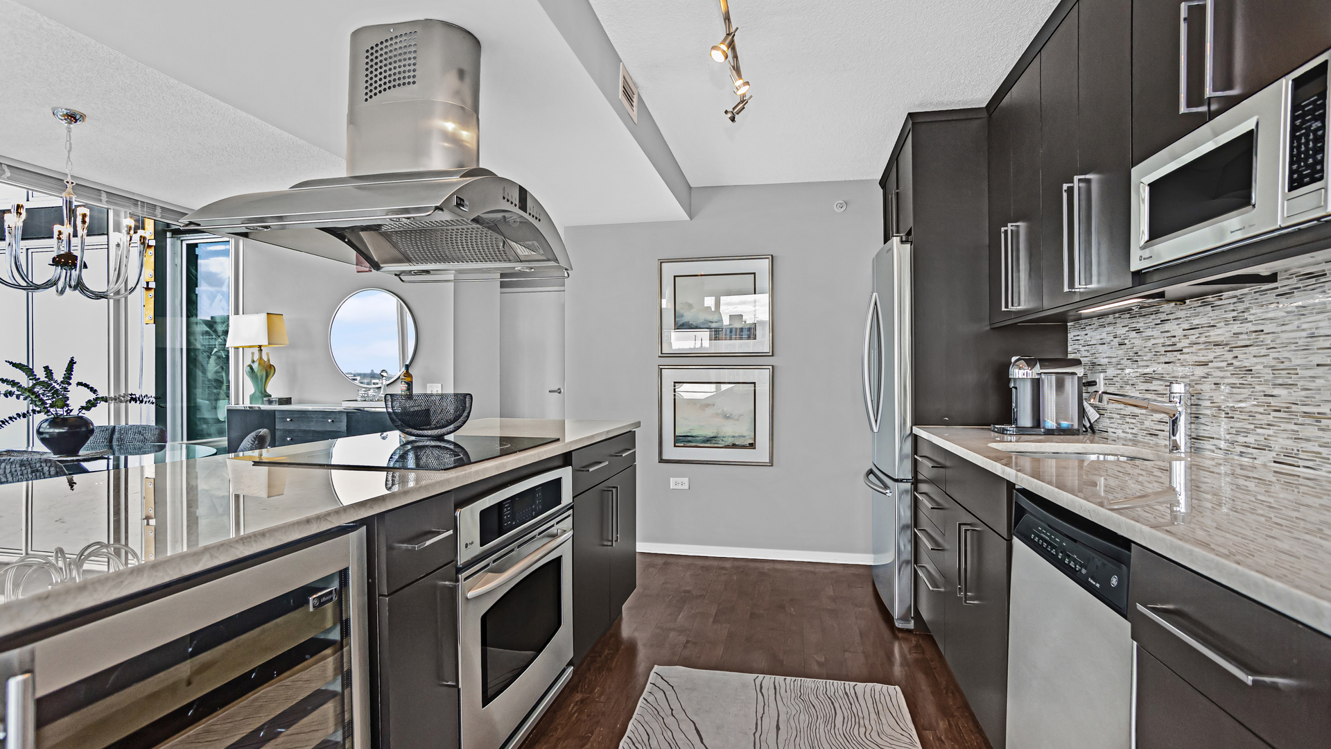 800 Elgin Road, Unit 1221 Evanston, IL 60201 - Photo 7 of 23 a kitchen with stainless steel appliances granite countertop a sink and stove
