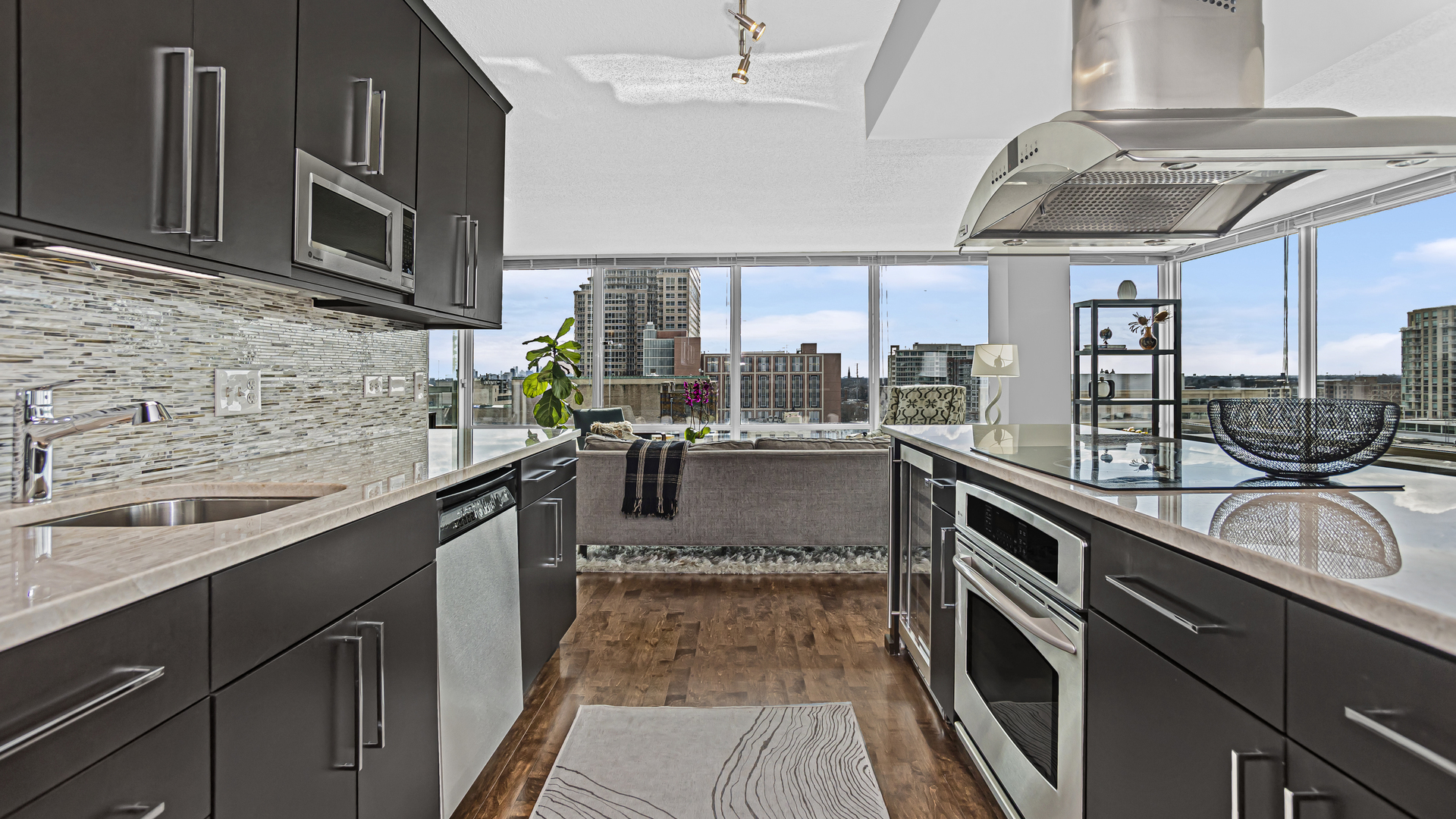 800 Elgin Road, Unit 1221 Evanston, IL 60201 - Photo 8 of 23 a kitchen with stainless steel appliances granite countertop a sink and stove