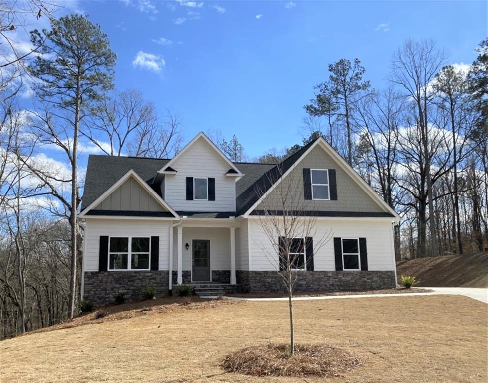 140 Hawthorn Lane Covington, GA 30014 - Photo 1 of 1 a front view of a house with a yard