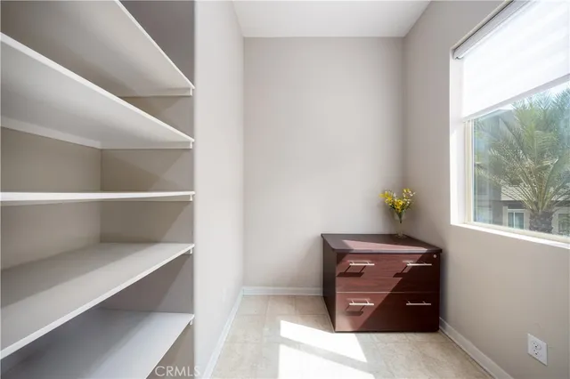 a living room with furniture and windows