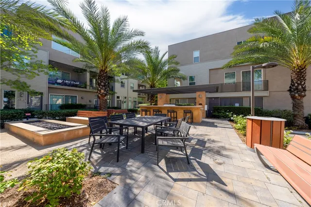 a view of a backyard with sitting area