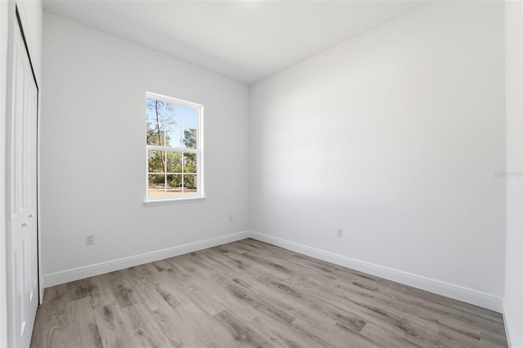 4473 Southwest 168th Lane Ocala, FL 34473 - Photo 20 of 33 an empty room with a window