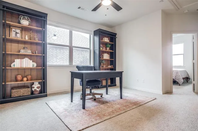 a workspace with furniture and window