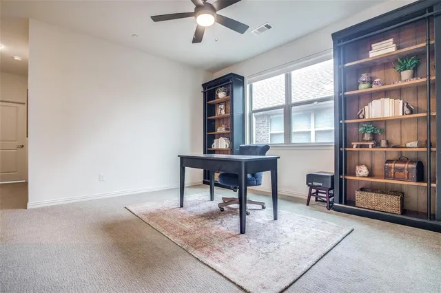 a workspace with furniture and a window