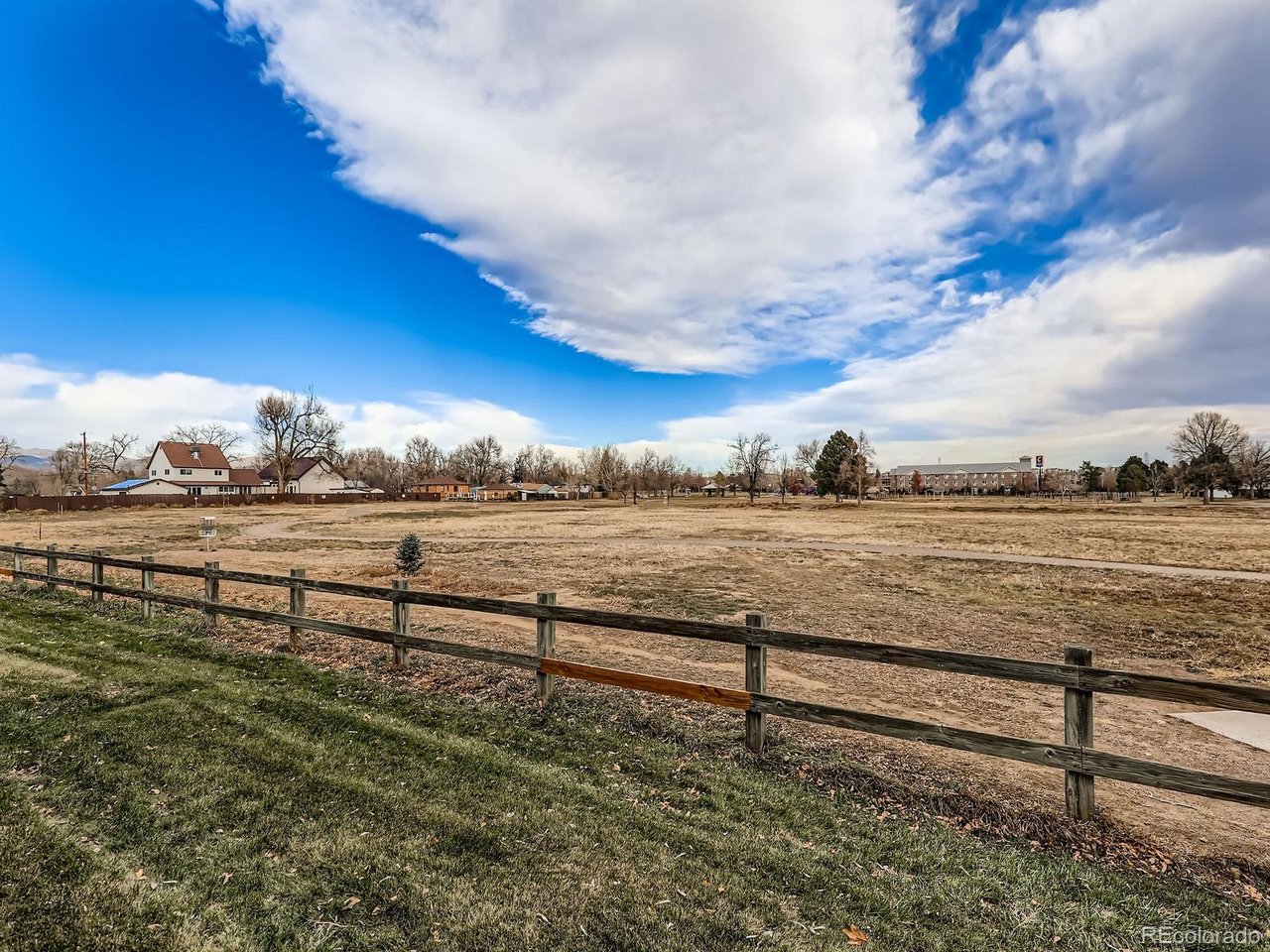 10251 West 44th Avenue, Unit 106 Wheat Ridge, CO 80033 - Photo 15 of 17 a view of a yard with an ocean view