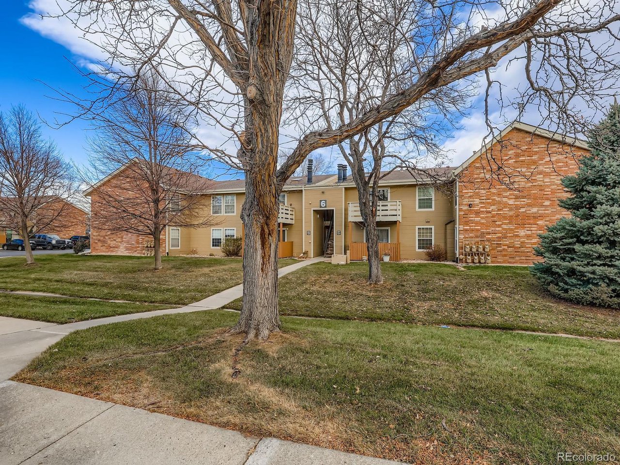 10251 West 44th Avenue, Unit 106 Wheat Ridge, CO 80033 - Photo 17 of 17 a view of a house with a yard