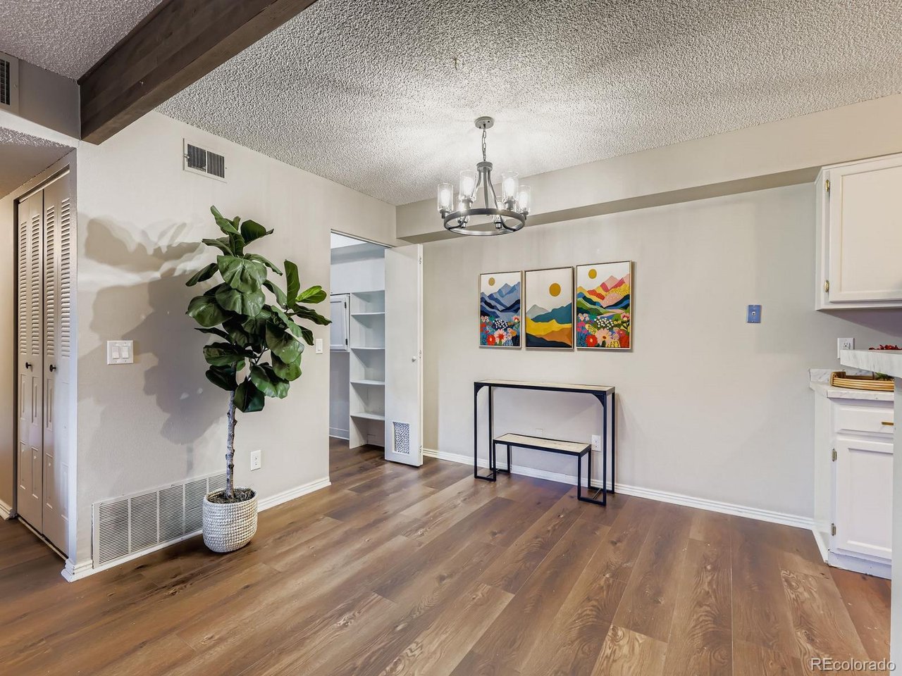 10251 West 44th Avenue, Unit 106 Wheat Ridge, CO 80033 - Photo 3 of 17 a living room with furniture and a potted plant