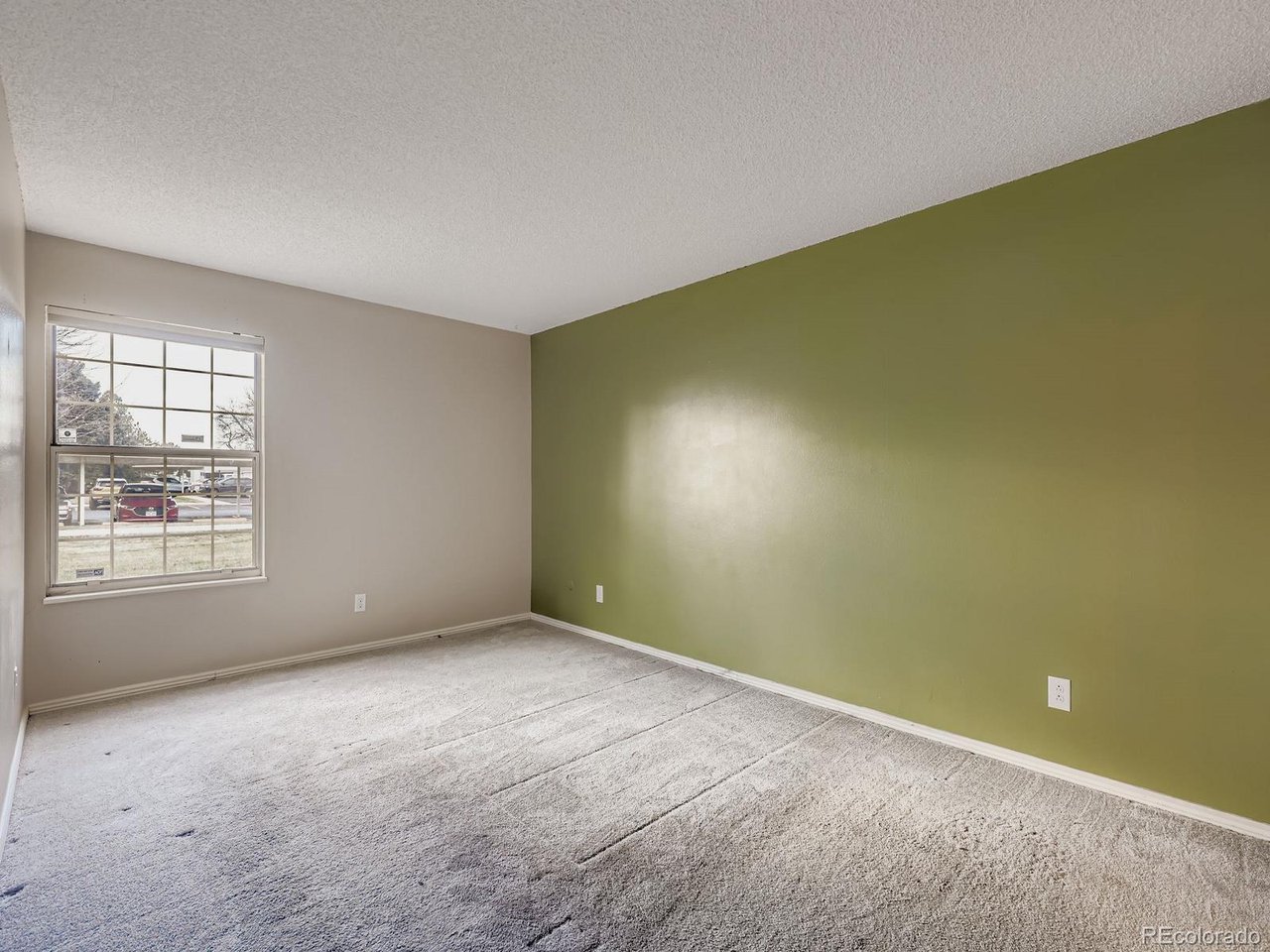10251 West 44th Avenue, Unit 106 Wheat Ridge, CO 80033 - Photo 9 of 17 an empty room with windows