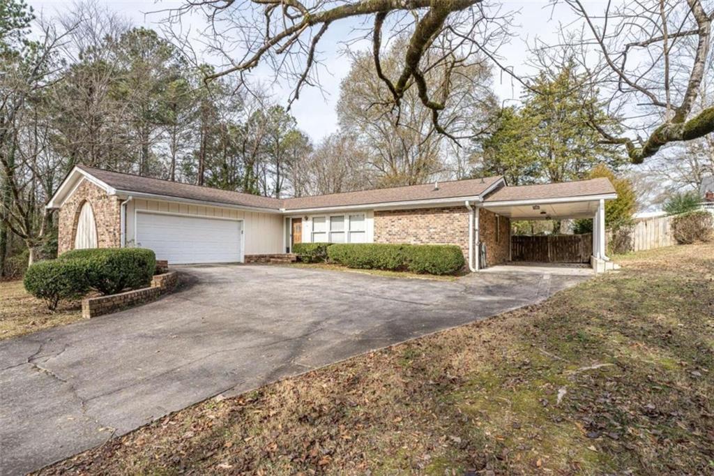 41 Ford Drive Southeast Rome, GA 30161 - Photo 1 of 1 a front view of a house with a yard and garage