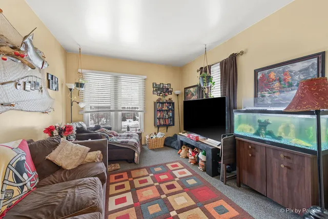 a bedroom with a bed and dresser with mirror
