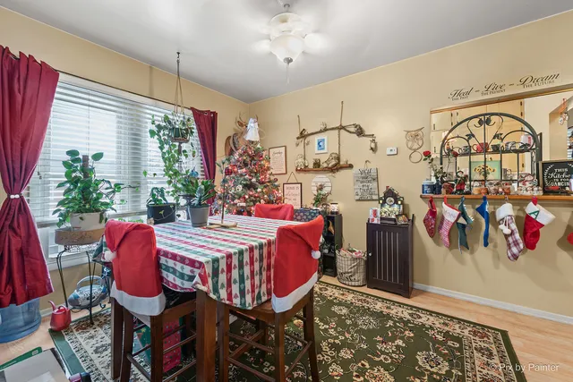 a front view of a house with a yard covered in snow