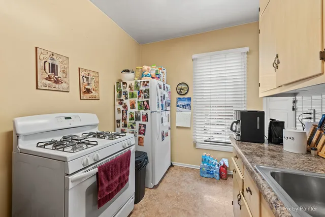 a view of a house with a snow in the yard