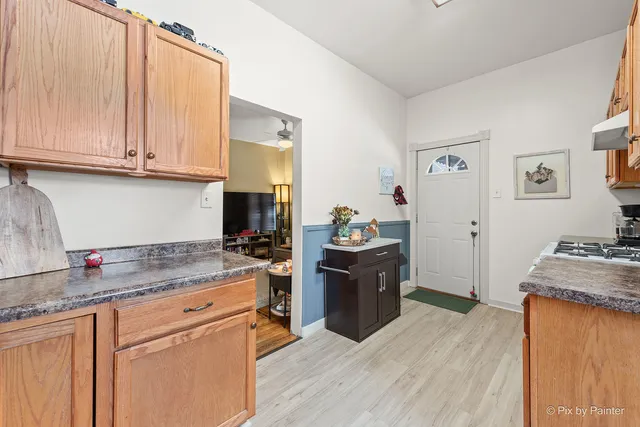 a view of a workspace with furniture and a workspace