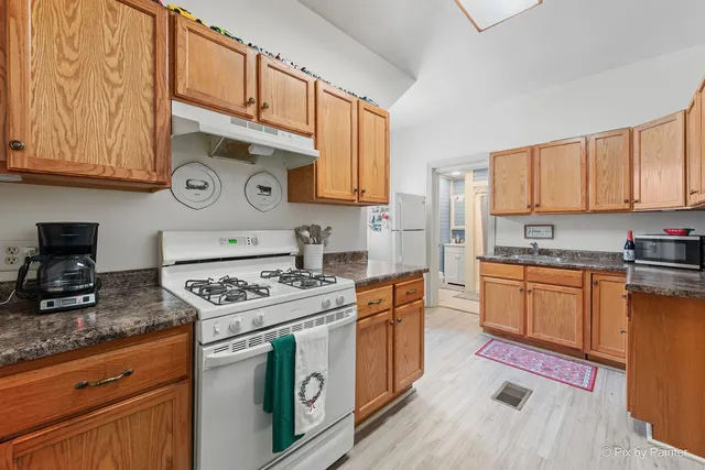 a bathroom with a toilet a sink and shower