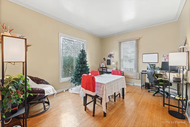 a living room with lots of furniture and a chandelier