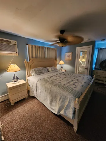 a bedroom with bed and window