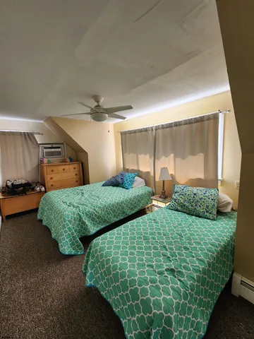 a bathroom with a sink mirror vanity and toilet