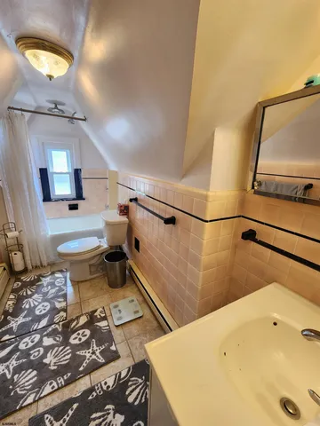 a view of patio with a table and chairs under an umbrella