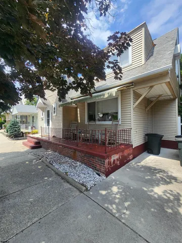 a view of a house with a patio