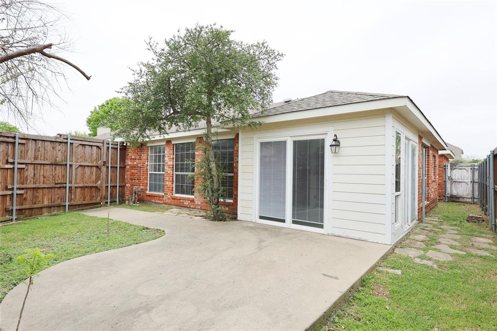 8112 Dock Street Frisco, TX 75035 - Photo 32 of 34 a view of a backyard with a garden