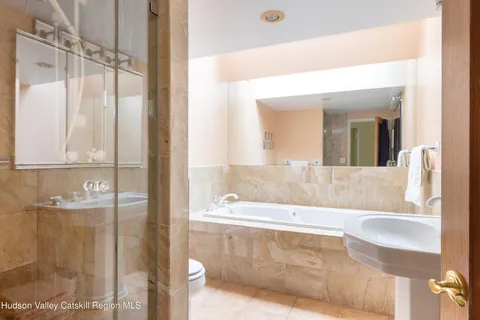 a bathroom with a bathtub and a sink