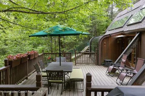 a view of balcony with furniture and outdoor seating