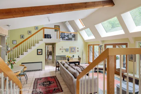 a view of entryway livingroom and hall with wooden floor