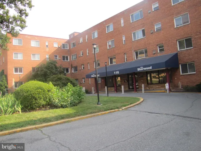 a view of a building with a yard